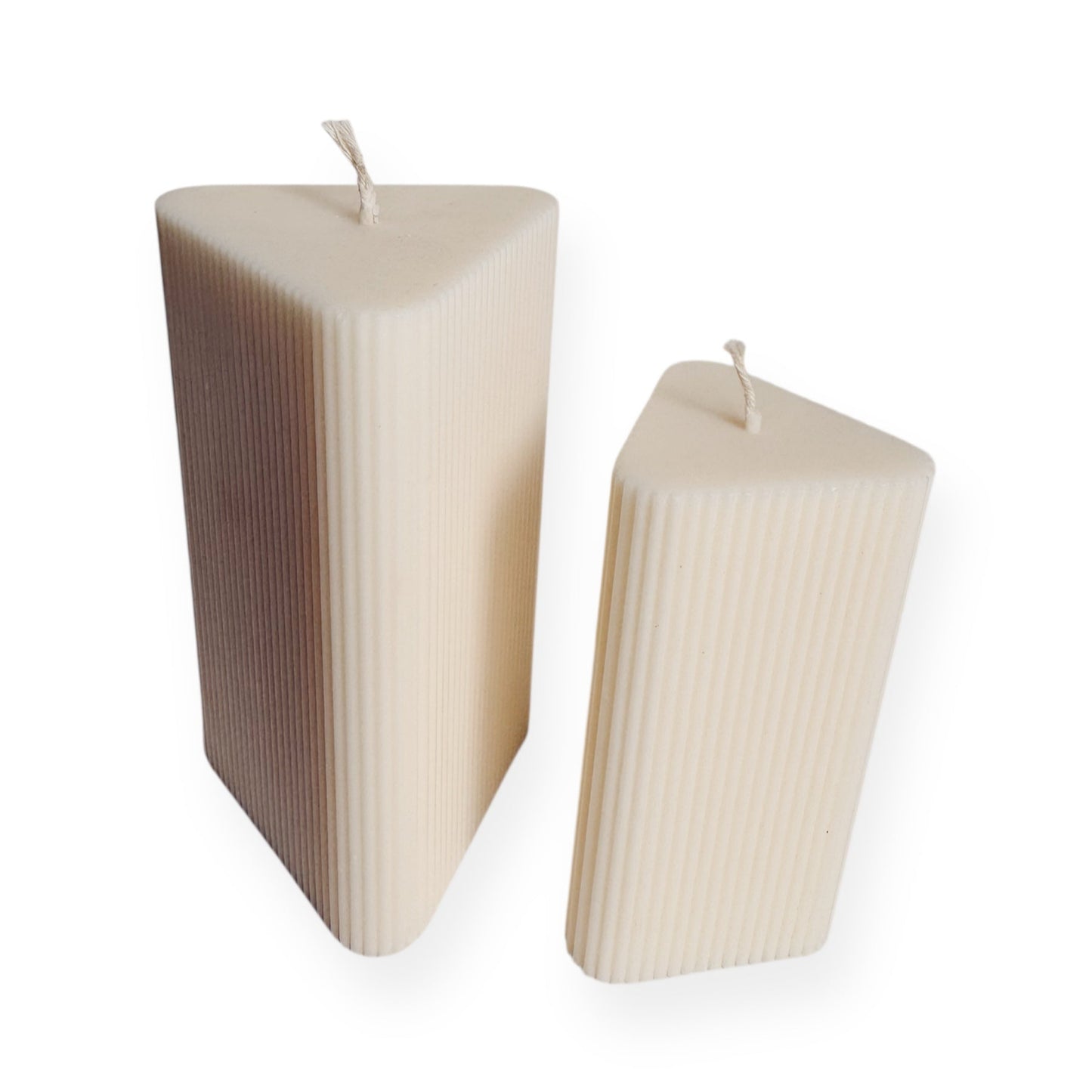 Two triangular ribbed candles on a white background (2 different sizes)